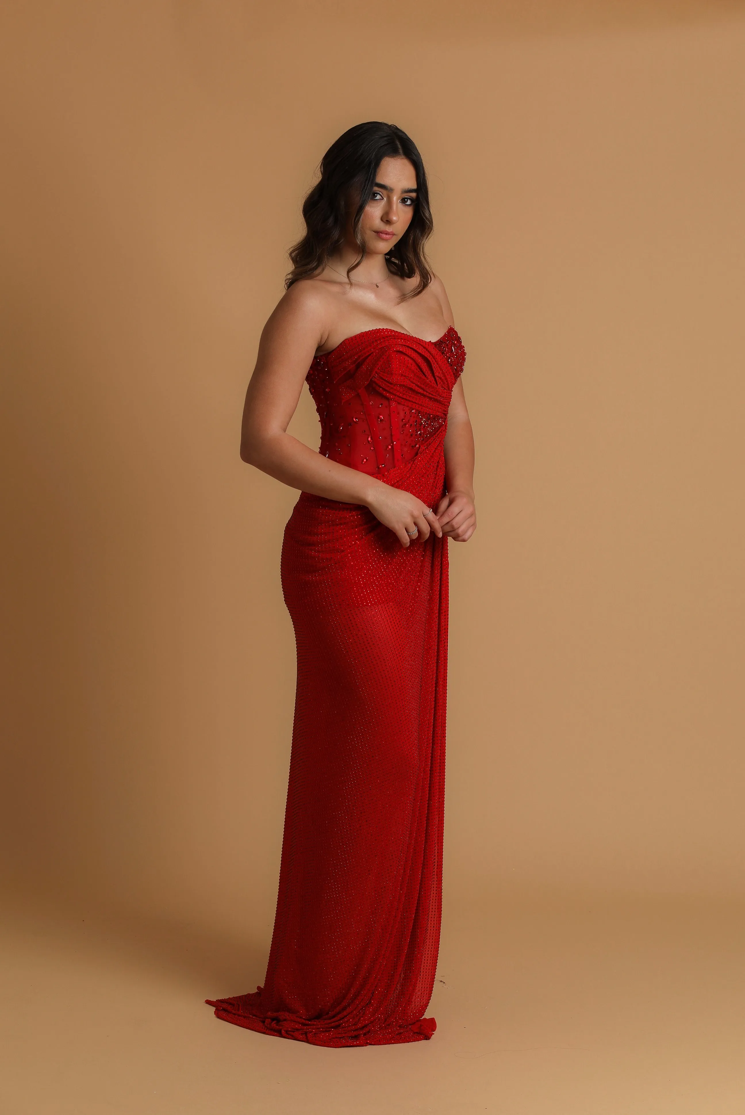 Red satin column shaped dress with high slit